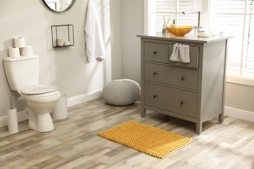Luxury bathroom featuring porcelain tile flooring installed during a Lakewood remodel