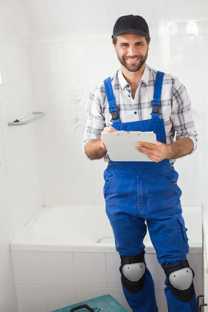 Top Builders Contractor going over permits pulled from Wheat Ridge for bathroom remodel. 